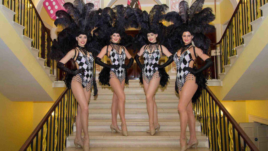 Black and white showgirls at luxury event
